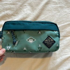 United by blue makeup or travel bag